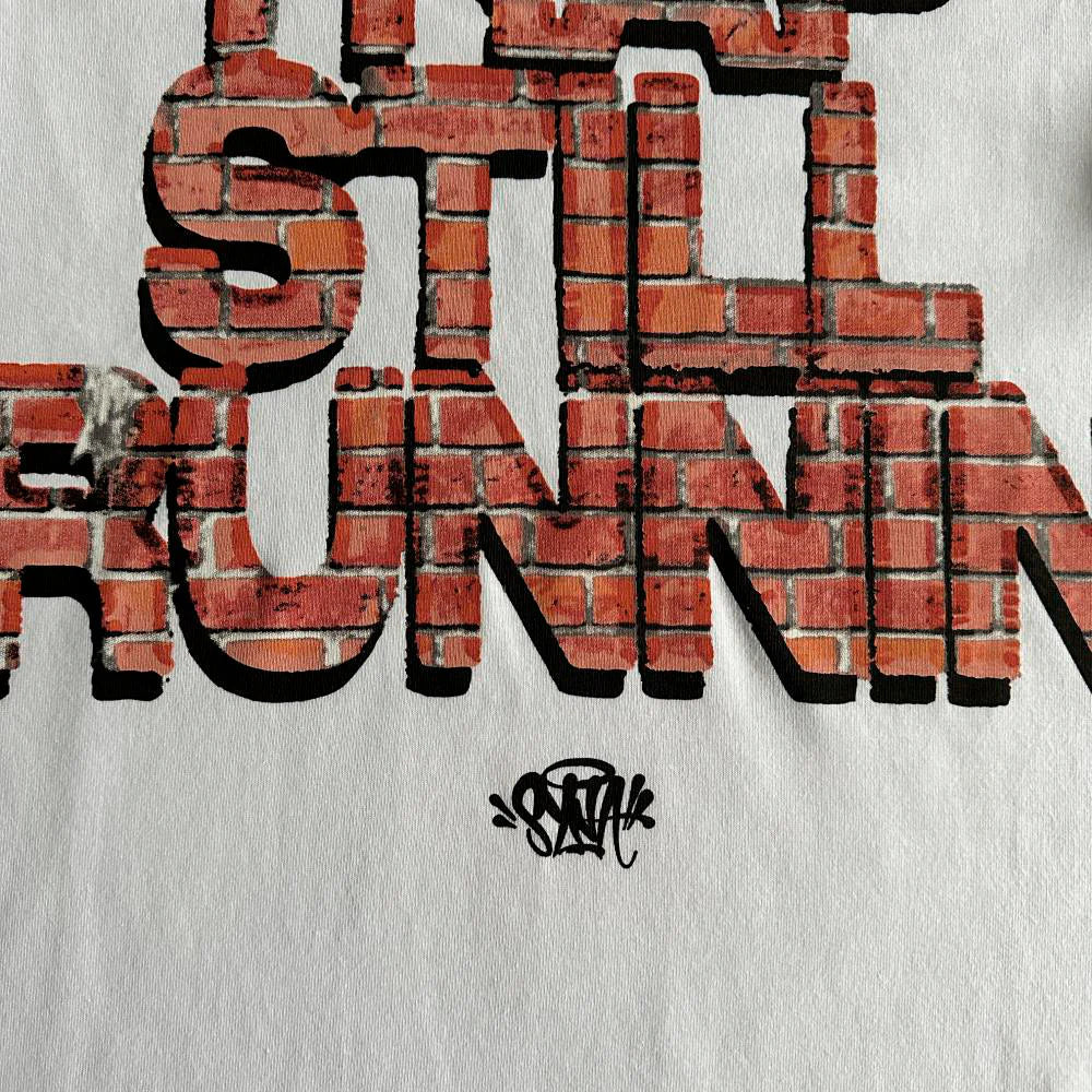 TRAP STILL RUNNIN TEE